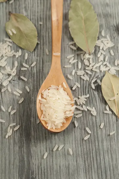 Rice in a wooden spoon — Stock Photo, Image