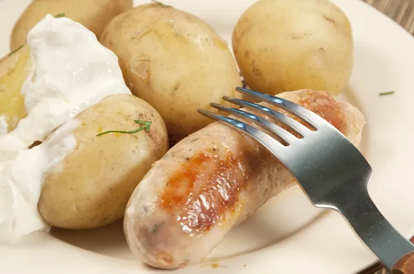 Boiled Young potatoes with sausage — Stock Photo, Image