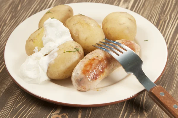 Boiled Young potatoes with sausage — Stock Photo, Image