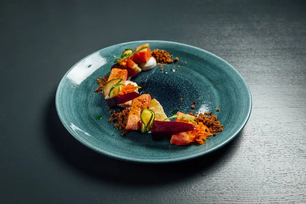 Fresh and beutiful slow cooked salmon on dark blue background, micheli star restaurant