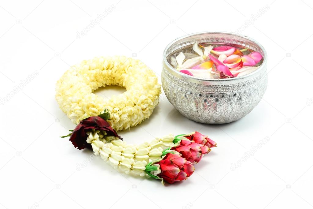 Thai garland Flowers and Water with jasmine and roses corolla in bowl  on white background