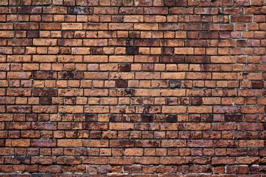 Eski kırmızı tuğla duvar.