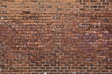 Eski kırmızı tuğla duvar.