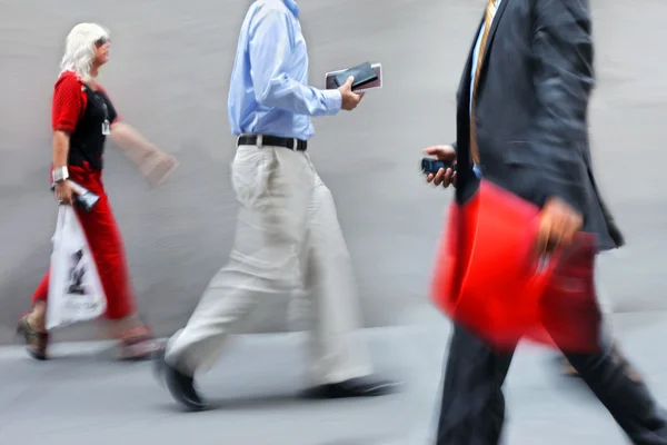 Motion blurred business people walking on the street — Stock Photo, Image