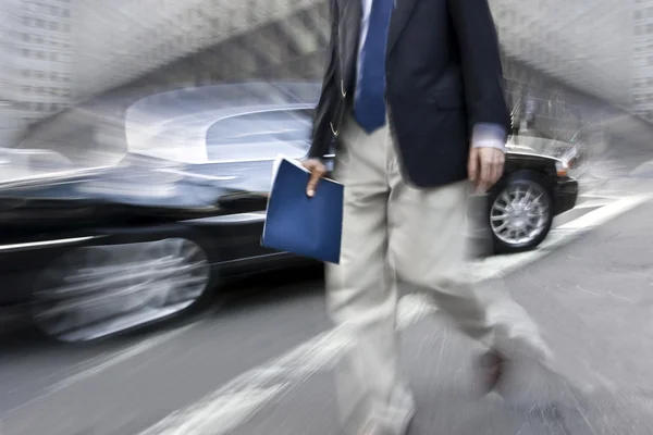 Motion blurred business people walking on the street — Stock Photo, Image