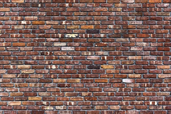De oude rode bakstenen muur — Stockfoto