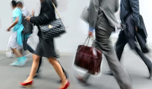 Motion blurred business people walking on the street — Stock Photo, Image