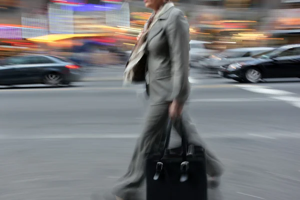 Motion blurred business people walking on the street — Stock Photo, Image