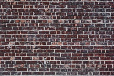 Eski kırmızı tuğla duvar.