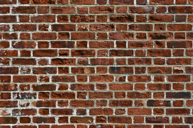 Eski kırmızı tuğla duvar.
