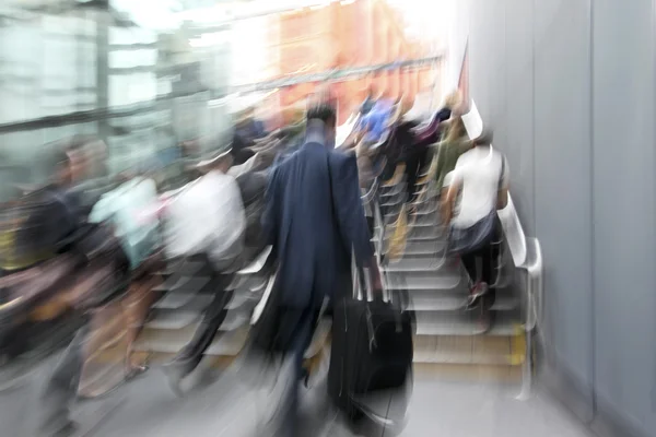 Motion blurred business people walking on the street Stock Image