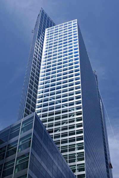 Glass facades of modern of tall buildings and skyscrapers