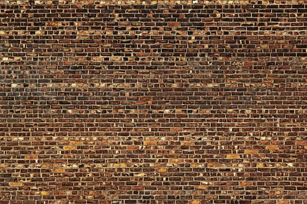 Die alte rote Backsteinmauer — Stockfoto