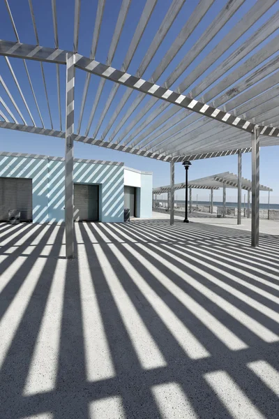 Beach shelters on the sea coast — Stock Photo, Image