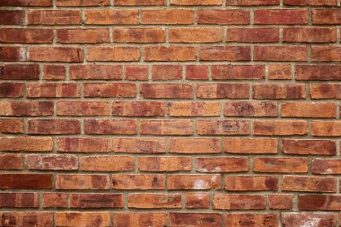 Eski kırmızı tuğla duvar.