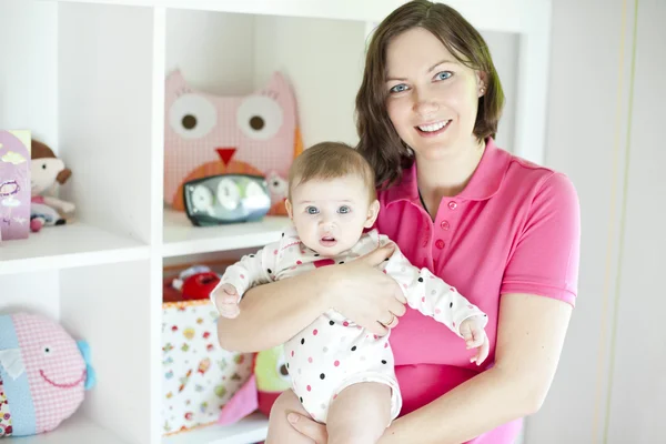 Mother and baby in playroom — Stock Photo, Image