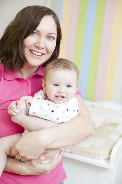 Happy mother and child in nursery — Stock Photo, Image