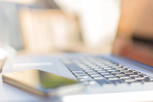 Modern laptop and smartphone — Stock Photo, Image