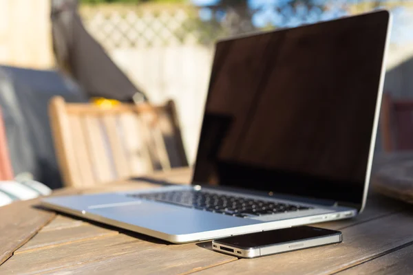 Modern laptop and smartphone — Stock Photo, Image