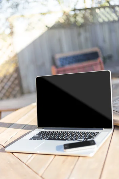 Modern laptop and smartphone — Stock Photo, Image