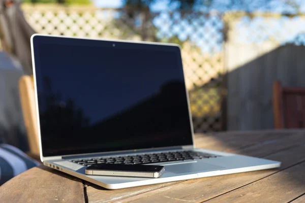 Modern laptop and smartphone — Stock Photo, Image