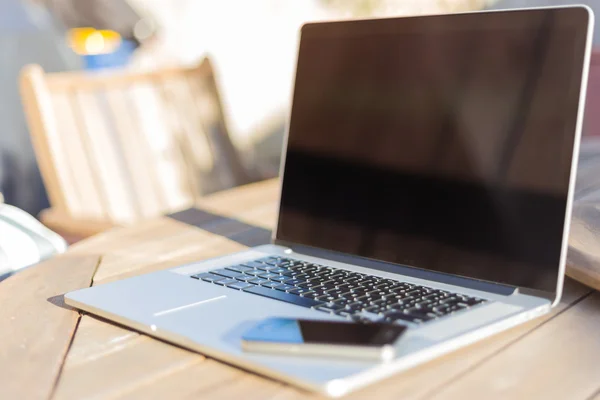 Modern laptop and smartphone — Stock Photo, Image