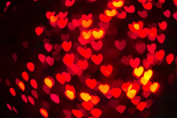 Coração em forma de Bokeh feriado luzes fundo — Fotografia de Stock
