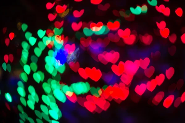 Coração em forma de Bokeh feriado luzes fundo — Fotografia de Stock