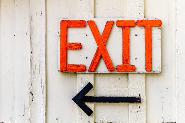 Homemade orange exit sign and arrow — Stock Photo, Image
