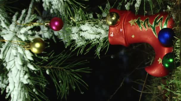 Close up of christmas decorations on a fir tree branch — Stock Video