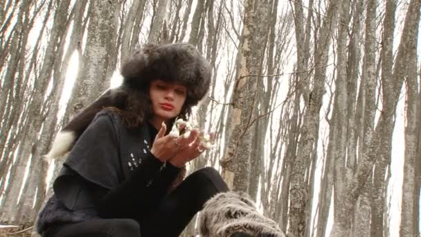 Beautiful girl in fur hat with flower — Stock Video