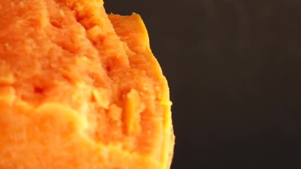 Macro Shooting Sweet Orange Yam Slices Rotating Turntable Isolated Black — Stock Video