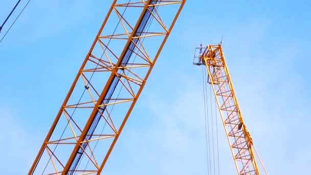 Large Construction Site Several Busy Cranes Dusk Clear Blue Sky — Stockvideo