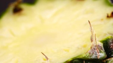 4K Phuket pineapple sliced pieces of delicious pineapple fruit Tropical food Rotate isolated on black background