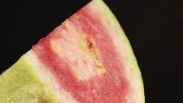 Macro Close Organic Sliced Guava Rotating Plate Isolated Black Background — Video Stock