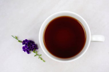 Tea in white cup laid on granite floor old wall food and drink. 