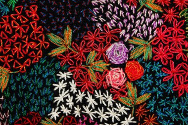 Colorful thai handcraft Kosher style rug surface old vintage torn conservation Made from natural materials Chemical free close up.