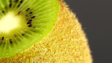  4K kiwi fruit. heap sliced and whole kiwi fruit close up, rotating