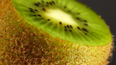  4K kiwi fruit. heap sliced and whole kiwi fruit close up, rotating