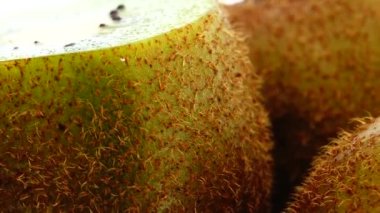  4K kiwi fruit. heap sliced and whole kiwi fruit close up, rotating