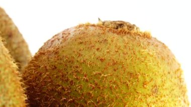  4K kiwi fruit. heap sliced and whole kiwi fruit close up, rotating