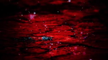  SLOW MOTION 250fps CLOSE UP: Rain drops intothe cement floor close up. It briefly bounces back to the air after it hits the sea surface, slow motion.