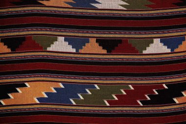 Colorful thai handcraft peruvian style rug surface old vintage torn conservation Made from natural materials Chemical free close up.
