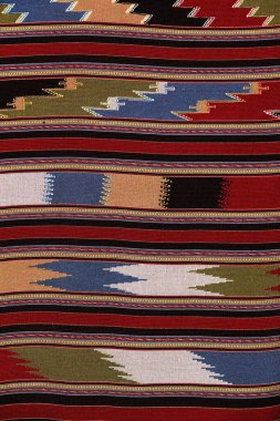 Colorful thai handcraft peruvian style rug surface old vintage torn conservation Made from natural materials Chemical free close up.