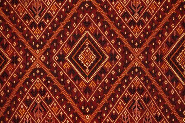 Colorful thai handcraft peruvian style rug surface old vintage torn conservation Made from natural materials Chemical free close up.