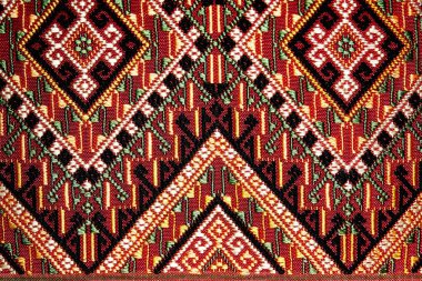 Colorful thai handcraft peruvian style rug surface old vintage torn conservation Made from natural materials Chemical free  close up