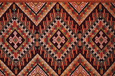 Colorful thai handcraft peruvian style rug surface old vintage torn conservation Made from natural materials Chemical free  close up