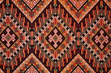 Colorful thai handcraft peruvian style rug surface old vintage torn conservation Made from natural materials Chemical free  close up
