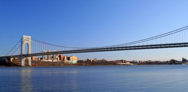 The George Washington Bridge crosses over the Hudson River from New Jersey to The Bronx, New York