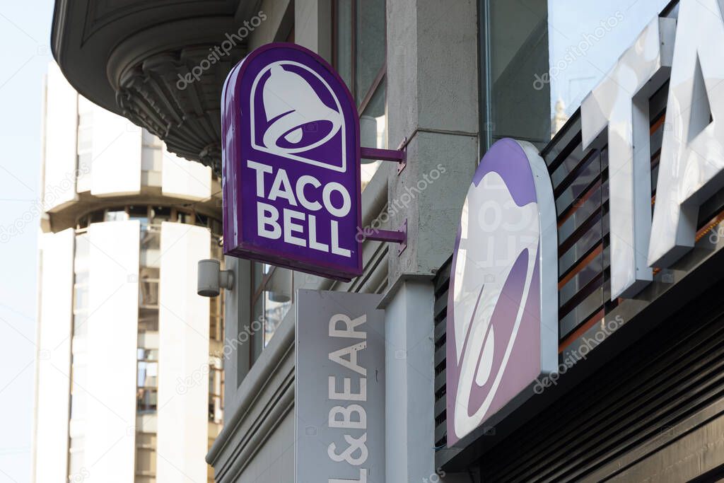 VALENCIA, SPAIN - OCTOBER 26, 2021: Taco Bell is an American-based chain of fast food restaurants. The restaurants serve a variety of Mexican-inspired foods
